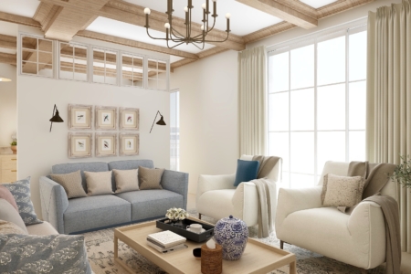 Chic living room design featuring large windows with sheer curtains, exposed wooden beams, and a mix of modern and traditional furniture including a blue sofa and wooden coffee table. This beautifully designed living room offers a blend of contemporary and classic elements, creating a warm and welcoming space. The room is bathed in natural light streaming through large windows dressed with sheer curtains, enhancing the airy feel. Exposed wooden beams add a rustic touch to the high ceilings, while elegant furnishings, including a soft blue sofa, plush armchairs, and a sturdy wooden coffee table, provide comfort and style. Decorative accents, such as a chandelier, wall-mounted sconces, and a collection of framed bird illustrations, contribute to the room’s sophisticated aesthetic. This living room is perfectly suited for relaxing or entertaining guests, with its spacious layout and thoughtful design details.