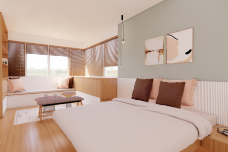 Interior view of a modern bedroom with a large window, wooden features, and a color palette of neutrals and soft pastels. This bedroom interior represents a peaceful sanctuary where design and comfort converge. Warm wooden accents and a soft neutral color scheme create a soothing atmosphere, highlighted by natural light streaming through the large corner window. The space is a masterful blend of functionality and style, with a plush bed inviting rest, and a bench by the window offering a perfect spot for reflection. The artful arrangement of abstract paintings on the wall adds a modern touch, while the strategic lighting enhances the room's welcoming aura. Designed with attention to detail, this bedroom is a testament to the balance between aesthetic appeal and lived-in comfort, ideal for those who appreciate understated elegance.