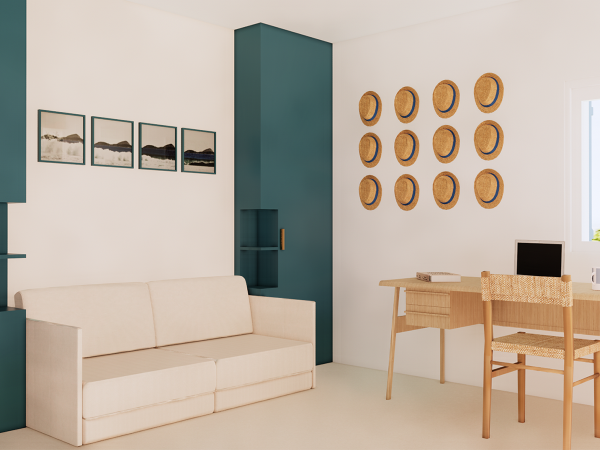 A home office space with a cream sofa, a wooden desk with a rattan chair, and decorative straw hats on a white wall. This image showcases a tranquil corner of a modern home office. The design is minimalist yet sophisticated, with a clean, crisp cream-colored sofa offering a comfortable seating option against a deep teal accent wall that adds a dash of refined color to the room. A natural wooden desk paired with a rattan-woven chair underscores the space's commitment to organic textures and materials. On the wall, a series of straw hats are arranged in a geometric pattern, providing an artistic and cultural touch. The opposite wall features a sequence of framed landscape photographs in a linear arrangement, creating visual interest and drawing the eye across the room. The space is well-lit, with natural light streaming in, highlighting the simplicity and elegance of the décor. This setup not only serves functional purposes for work and study but also creates an inviting atmosphere through its serene color palette and tasteful decoration.