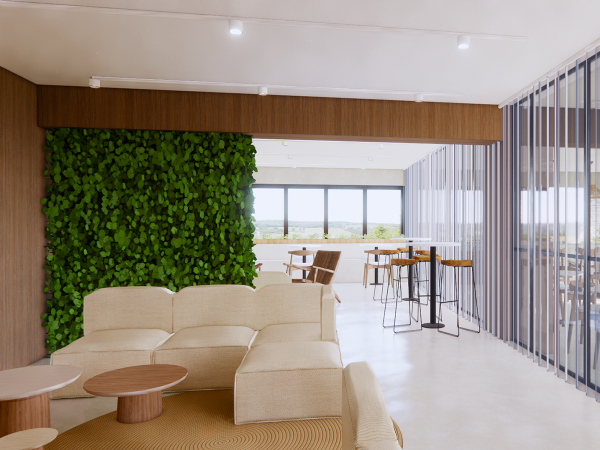 Bright and refreshing cafeteria corner with a living green wall, cream sofas, circular wooden tables, and sleek vertical blinds. Enter a cafeteria corner that embodies sustainable serenity, incorporating biophilic design principles to create a space that is both refreshing and harmonious. A living green wall stands as the centerpiece, a lush tapestry of foliage that brings the outside in, enhancing air quality and connecting diners to nature. The plush cream sofas provide a comfortable, informal seating area, perfect for relaxation or casual meetings. These are complemented by circular wooden tables, their natural finish contributing to the space’s organic aesthetic. Above, recessed lighting ensures a bright and welcoming ambiance, while the vertical blinds offer control over the natural light that spills through the expansive windows. The interior seamlessly blends into the outdoor landscape, visible through the glass, establishing a tranquil atmosphere that encourages occupants to pause and rejuvenate during their busy day. This cafeteria corner is not just a dining space; it’s a testament to design that prioritizes well-being and environmental connectivity.