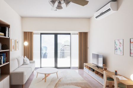 A modern living room with a neutral color palette, wooden furniture, and playful accents.
