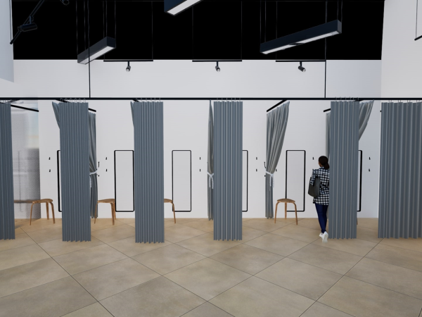 A row of fitting rooms with gray curtains in a retail store.