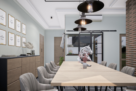 A modern dining room with a long wooden table, black metal chairs, and industrial lighting fixtures.